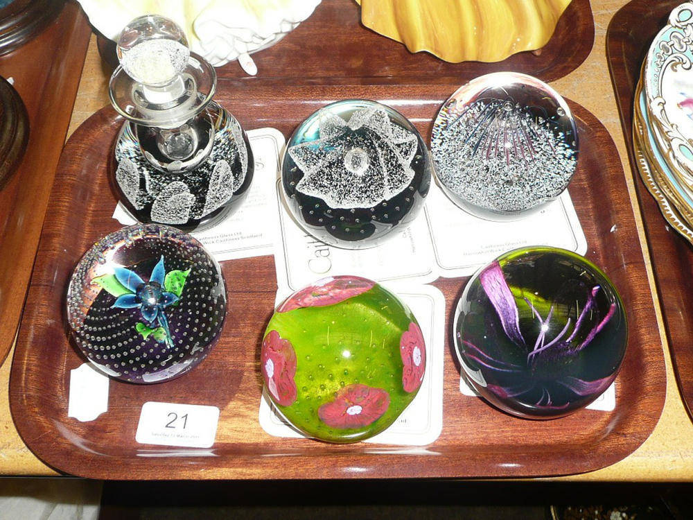 Lot 21 - Four limited edition Caithness glass paperweights, another and scent bottle and stopper (6)