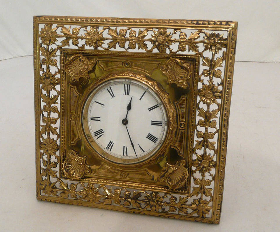 Lot 29 - Pierced brass easel framed mantel timepiece