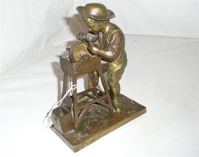 Lot 35 - A bronze of a knife grinder signed Charles Menn