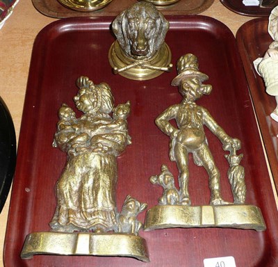 Lot 40 - A pair of brass Punch doorstops and brass dog inkwell (3)