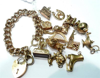 Lot 85 - A 9ct gold bracelet and thirteen gold charms