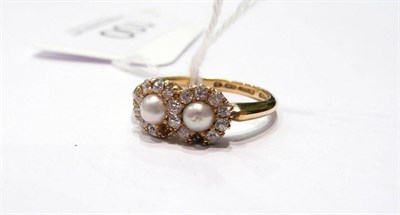 Lot 100 - A double pearl and diamond cluster ring (two stones missing)