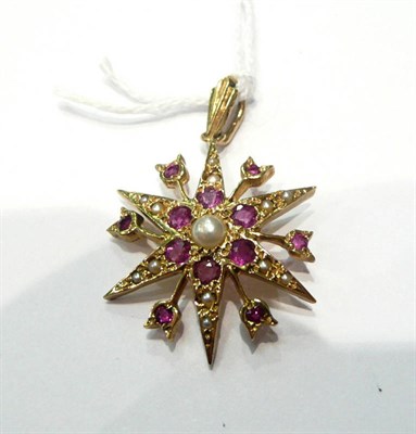 Lot 103 - A 9ct gold seed pearl and ruby-set star pendant