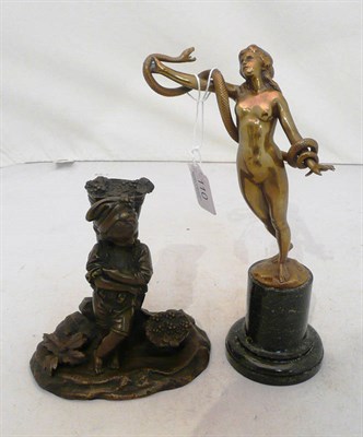 Lot 110 - Bronze figure of a young boy 'grape picker' and a brass figure of a nude with serpent, indistinctly