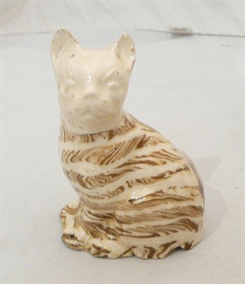 Lot 114 - A Whieldon type hollow-cast agateware cat