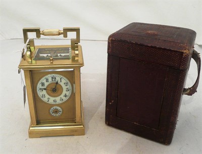 Lot 134 - Brass-cased carriage clock with key and leather case