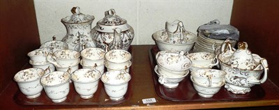 Lot 154 - A shelf including 19th century gilt decorated tea wares