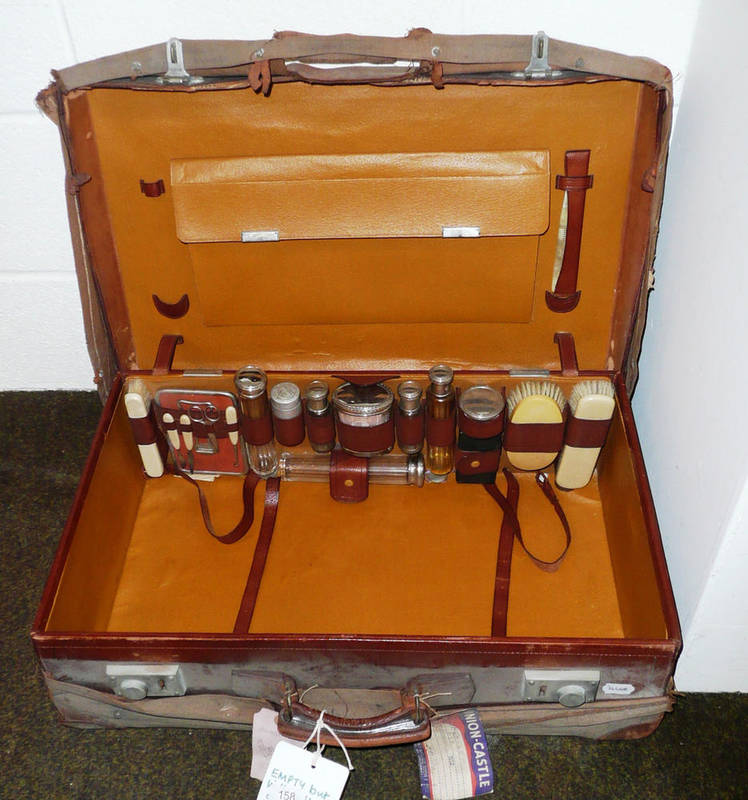 Lot 158 - Leather suitcase with complete silver-plate topped travelling set and manicure set