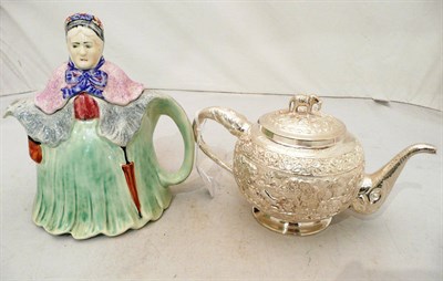 Lot 189 - Indian white metal presentation teapot with elephant-moulded handle and spout and a pottery...