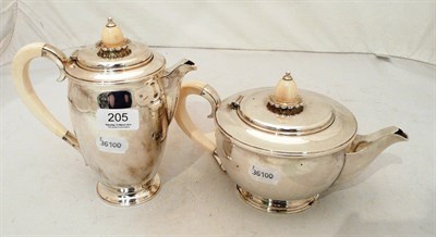 Lot 205 - A silver tea pot with ivory handle and finial and matching coffee pot/hot water jug, Sheffield...