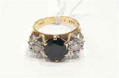 Lot 215 - An 18ct gold three stone ring
