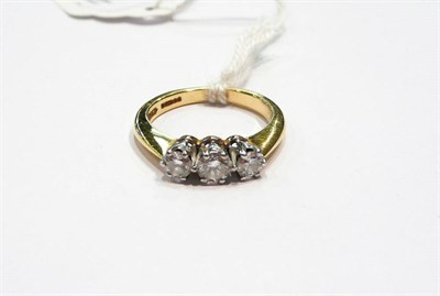 Lot 223 - A three stone diamond ring