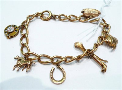 Lot 225 - 18ct gold charm bracelet