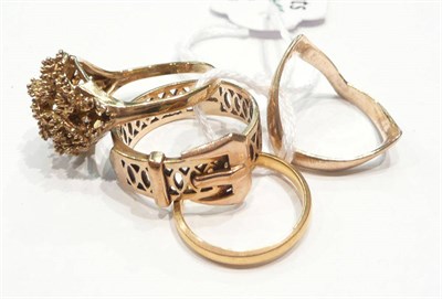 Lot 245 - A 22ct gold band ring, a 9ct gold wishbone ring and two 9ct gold dress rings