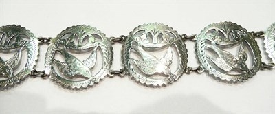 Lot 250 - Silver lady's hinged belt  with pierced swallow decoration