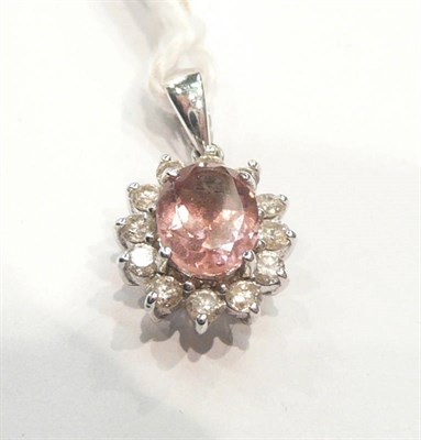 Lot 265 - Pink sapphire and diamond pendant with card report
