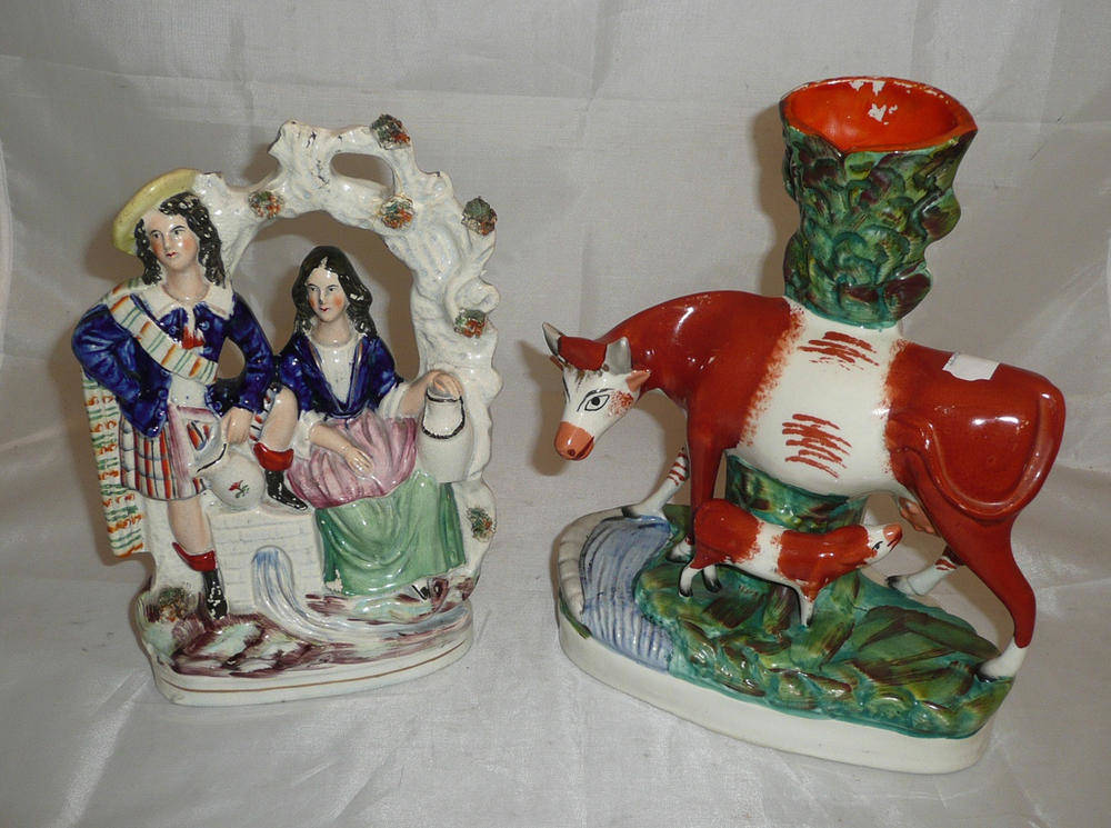 Lot 41 - A Staffordshire cow and calf group and a Staffordshire Arbour group