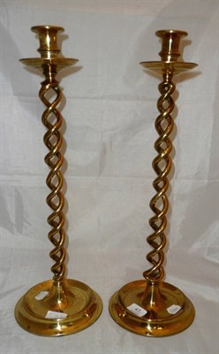 Lot 47 - A pair of brass candlesticks