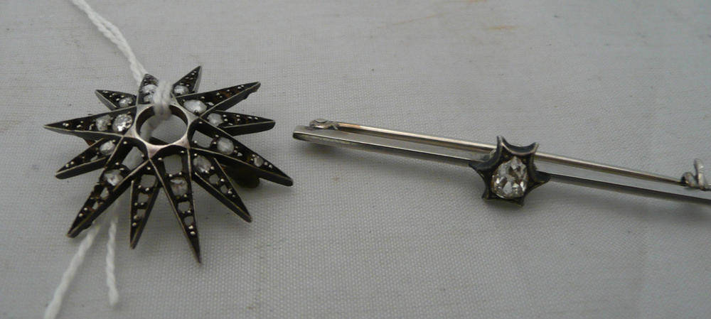 Lot 70 - A diamond-set bar brooch and a diamond-set star brooch (a.f.)