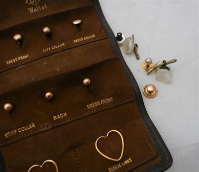 Lot 85 - A dress stud case containing various 9ct and 18ct studs etc