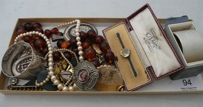 Lot 94 - A small collection of costume jewellery including a cameo brooch, silver napkin rings etc