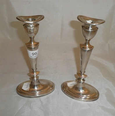 Lot 99 - A pair of loaded silver candlesticks (a.f.)