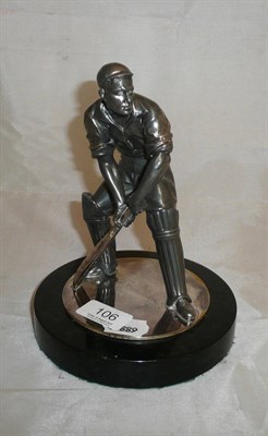 Lot 106 - A metal figure of a cricketer