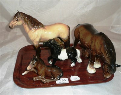 Lot 165 - A Beswick Highland pony, a grazing Shire, a lying foal and an early Hummel model of a Shetland pony