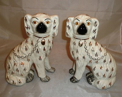 Lot 202 - Pair of Staffordshire dogs with both front legs open