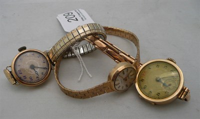 Lot 209 - Two gold watches with gold bracelets and another