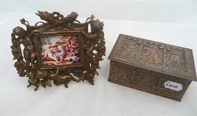 Lot 262 - A metal casket and metal framed miniature of Putti