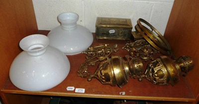 Lot 274 - Two brass bracket oil lamps with shades and two brass boxes