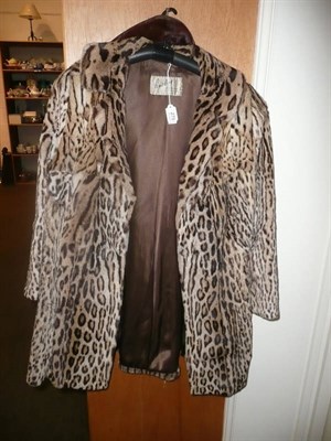 Lot 275 - A 'Busbys Of Yorkshire' ocelot jacket and a fur stole (2)