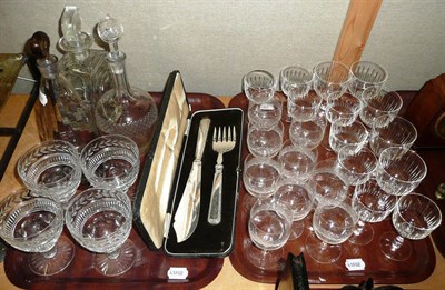 Lot 293 - Quantity of assorted drinking glasses, decanters and fish servers on two trays