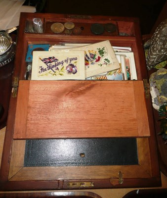 Lot 299 - A Victorian walnut writing slope with contents of Great British and foreign coins, bank notes...