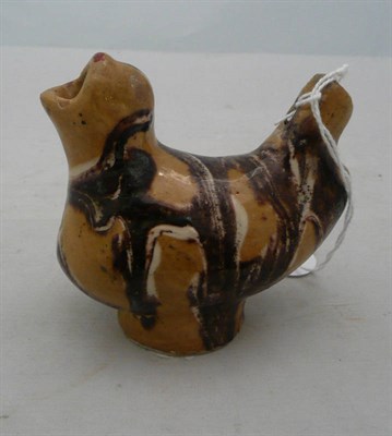 Lot 317 - An agateware pottery whistle