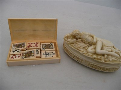 Lot 320 - Ivory miniature playing cards, boxed and an oval resin box