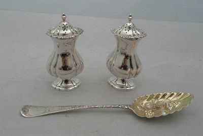 Lot 334 - Pair of silver condiments and a silver berry spoon