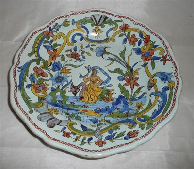 Lot 358 - A polychrome decorated Delft plate