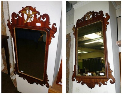 Lot 391 - Two mahogany fret cut mirrors