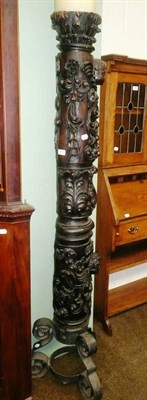 Lot 410 - Pair of carved mahogany columns on wrought iron stands