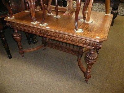 Lot 422 - Carved oak dining table