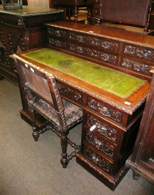 Lot 433 - A Victorian carved oak pedestal desk and a Cromwellian-style chair