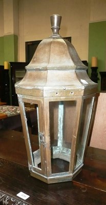 Lot 435 - A brass wall lantern with new glass