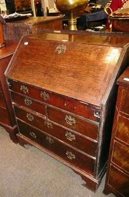 Lot 440 - A Georgian oak bureau