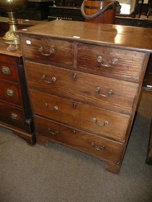 Lot 446 - George III oak four height chest