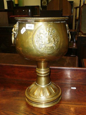 Lot 448 - A brass jardiniere with lion head handles