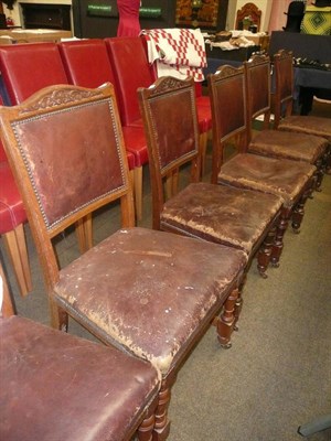 Lot 456 - A set of six Victorian oak and leather dining chairs