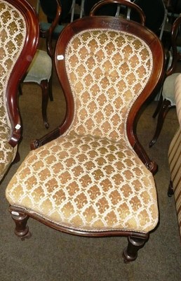 Lot 460 - A Victorian walnut framed spoon back armchair