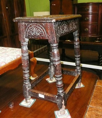 Lot 479 - A carved oak joint stool, St Anthony